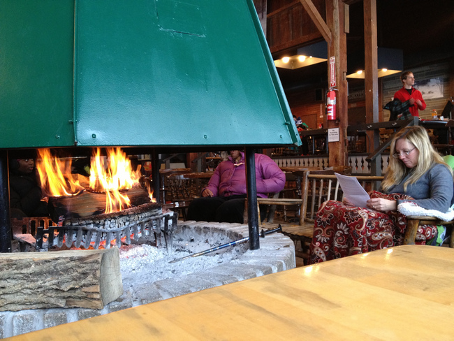 Rustic Daylodge at Snow Trails provides a cozy fireplace atmosphere for reading