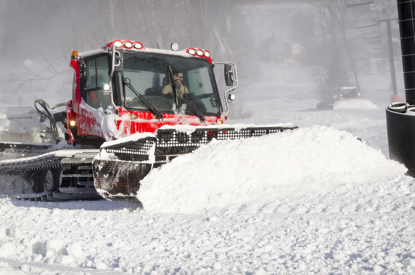 Pisten Bully Snow Cat pushing fresh snow in Mogul Area at Snow Trails